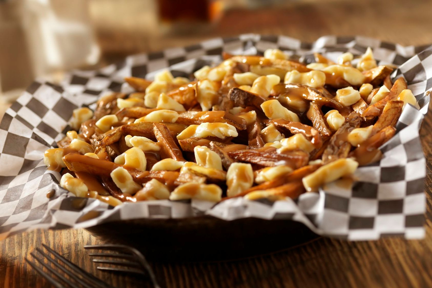 Poutine-GettyImages-154959976-58edaa473df78cd3fc78d1fb.jpg