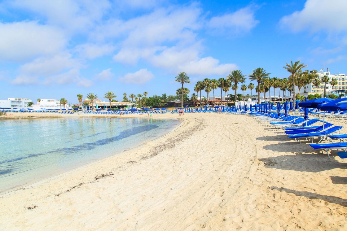 beaches-in-cyprus-blue-beach-umbrellas-and-sunbeds-on-sandy-beach-in-ayia-napa-cyprus-416-8212.jpg